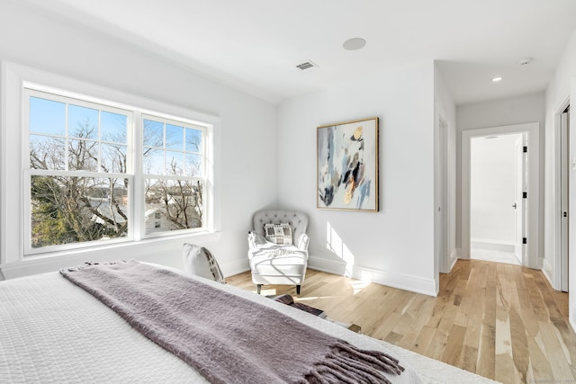 bedroom featuring recessed lighting, wood finished floors, visible vents, and baseboards