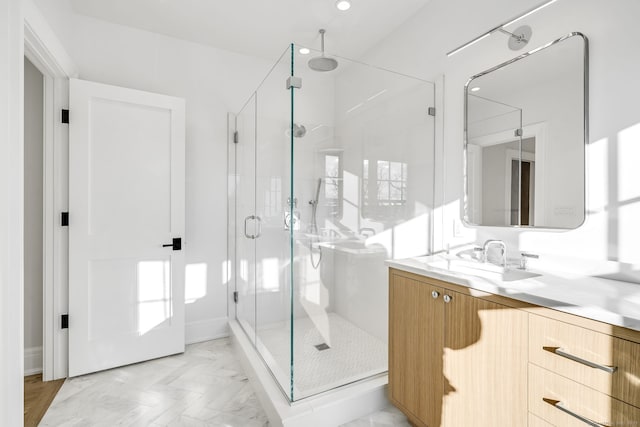 bathroom with a stall shower, marble finish floor, recessed lighting, and vanity