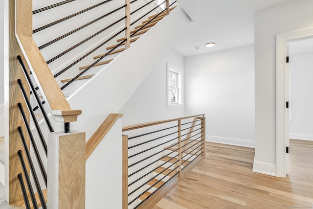 interior space with baseboards and wood finished floors