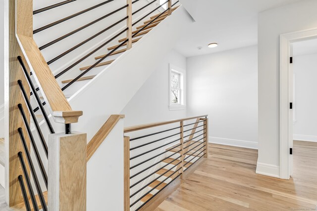 25 Henry St Unit B, Greenwich, CT 06830 - stairway featuring wood finished floors and baseboards