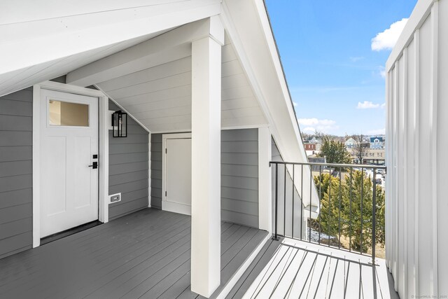 entrance to property with a balcony