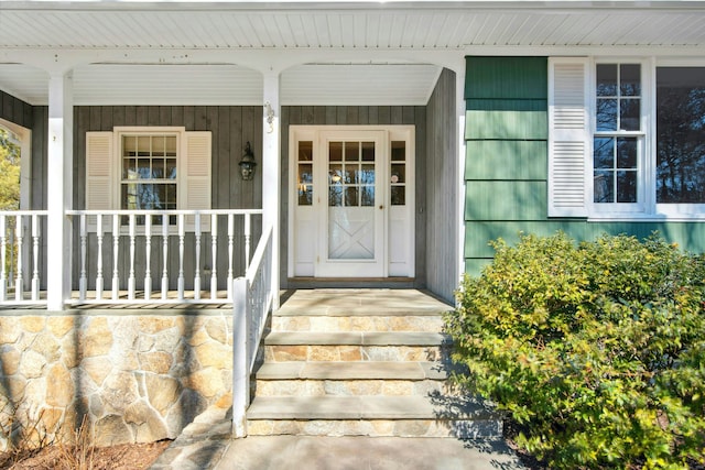 property entrance with covered porch