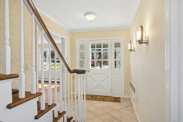 entryway featuring light tile patterned flooring, a baseboard radiator, baseboards, stairs, and crown molding