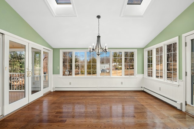 unfurnished sunroom with a chandelier, vaulted ceiling with skylight, french doors, and a baseboard radiator