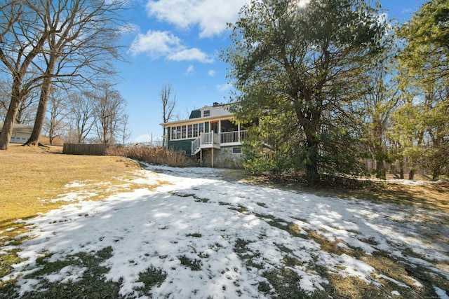 view of front of house featuring a sunroom