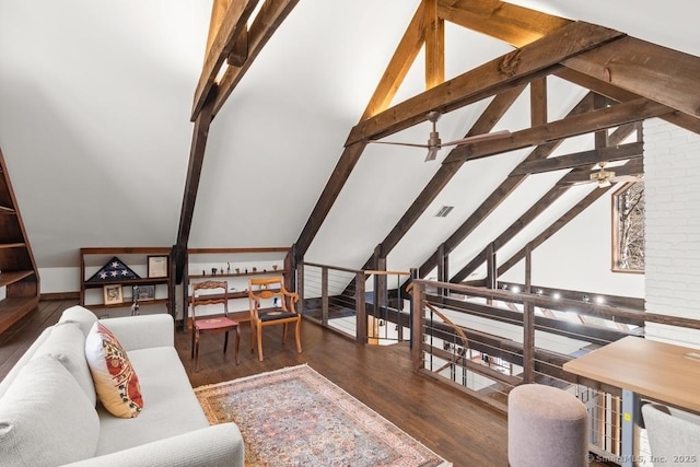 living area featuring vaulted ceiling with beams, visible vents, wood finished floors, and a ceiling fan