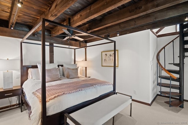 bedroom with wood ceiling, carpet flooring, beamed ceiling, and baseboards