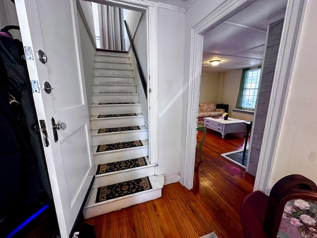 stairs with wood finished floors