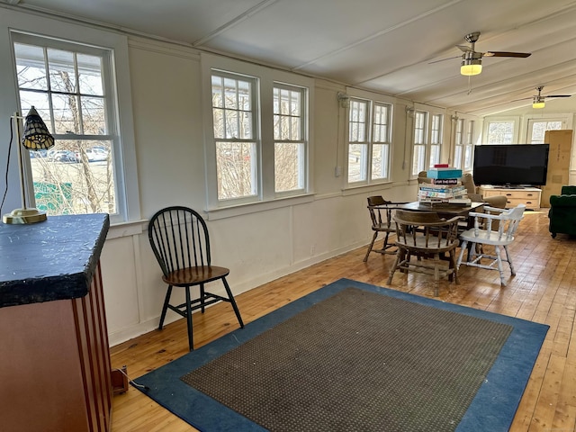 sunroom with vaulted ceiling and ceiling fan