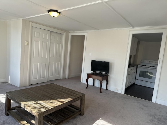 living room with carpet and baseboards