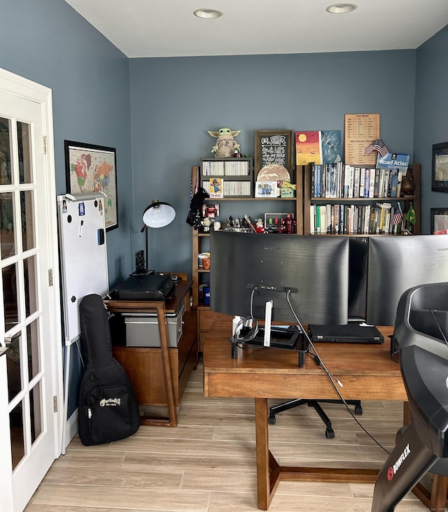 office area featuring light wood finished floors