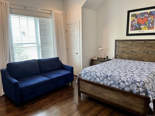 bedroom with dark wood finished floors