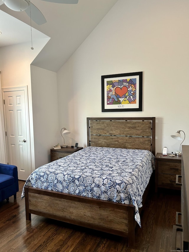 bedroom with lofted ceiling, a ceiling fan, and dark wood-style flooring