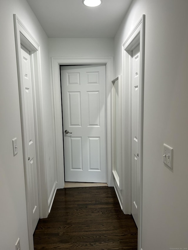 corridor with dark wood finished floors