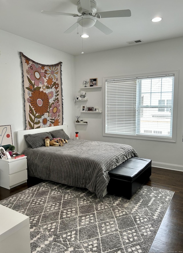 bedroom with dark wood-style floors, recessed lighting, visible vents, a ceiling fan, and baseboards