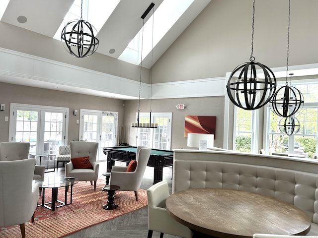 dining room featuring a skylight, high vaulted ceiling, french doors, and pool table