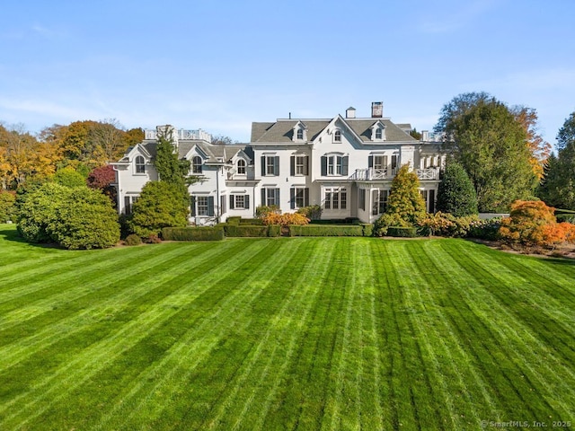 262 Brushy Ridge Rd, New Canaan, CT 06840 - back of property featuring a lawn and a balcony