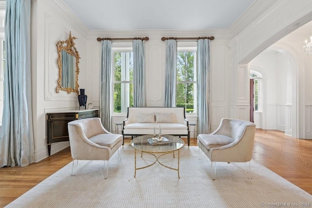 262 Brushy Ridge Rd, New Canaan, CT 06840 - sitting room with arched walkways, a decorative wall, and ornamental molding