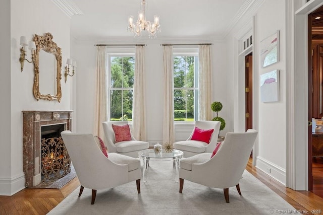 262 Brushy Ridge Rd, New Canaan, CT 06840 - sitting room with ornamental molding, a chandelier, wood finished floors, a high end fireplace, and baseboards