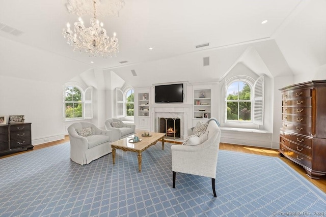 living room with recessed lighting, visible vents, vaulted ceiling, wood finished floors, and a warm lit fireplace