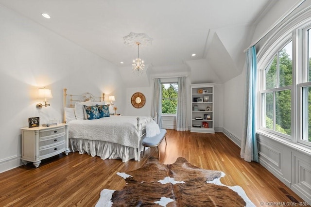 bedroom with lofted ceiling, recessed lighting, a notable chandelier, visible vents, and light wood-style floors