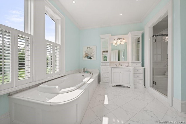 bathroom featuring a stall shower, marble finish floor, a garden tub, crown molding, and vanity