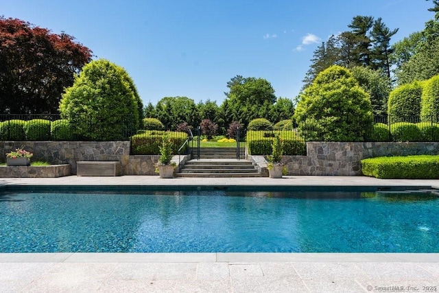 view of pool featuring fence and a fenced in pool