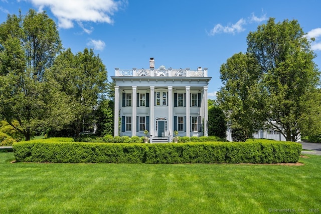 262 Brushy Ridge Rd, New Canaan, CT 06840 - greek revival inspired property with a front lawn and a chimney
