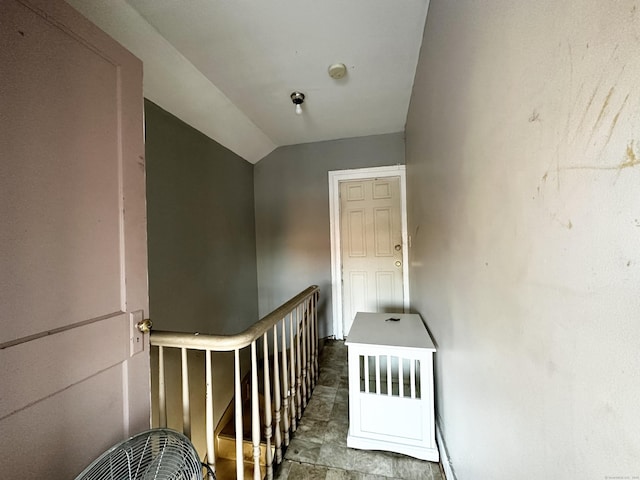 staircase with lofted ceiling