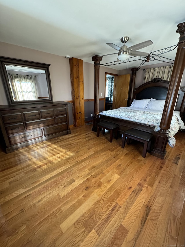 bedroom featuring multiple windows and light wood-style flooring