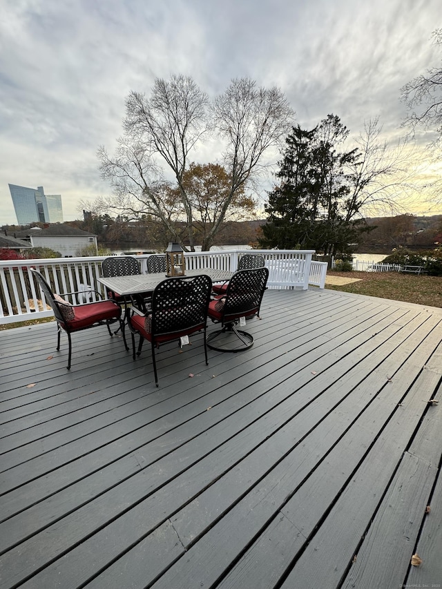 wooden terrace featuring outdoor dining area