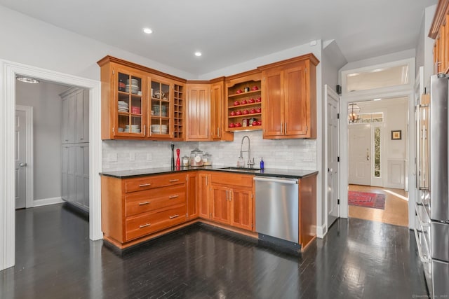 kitchen featuring open shelves, dark countertops, stainless steel appliances, and a sink