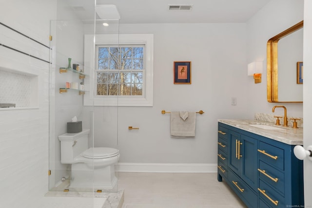 bathroom featuring toilet, vanity, visible vents, and baseboards