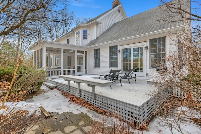 wooden terrace with a sunroom