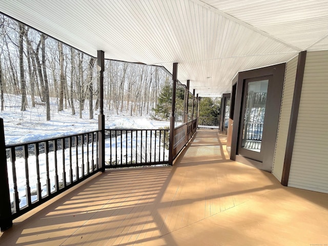 view of snow covered deck