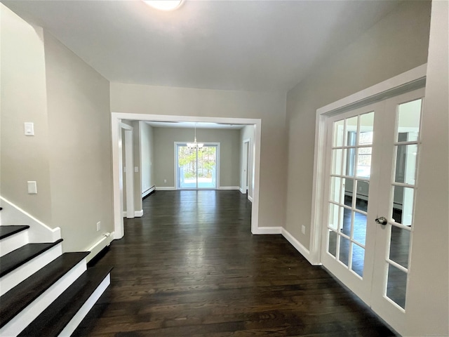 hallway with baseboards, stairs, french doors, dark wood-style floors, and an inviting chandelier