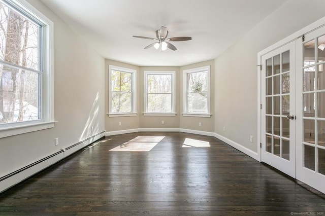 empty room featuring french doors, dark wood finished floors, a baseboard radiator, a ceiling fan, and baseboards