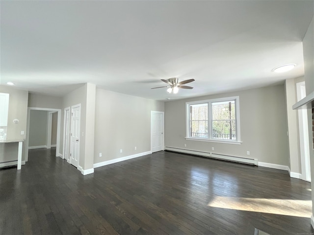 unfurnished room with a baseboard heating unit, dark wood-style flooring, baseboards, and a ceiling fan