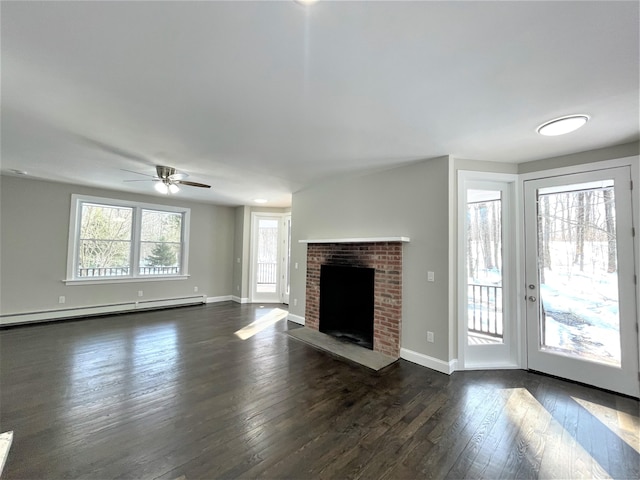 unfurnished living room with dark wood-style floors, a fireplace, baseboards, and baseboard heating