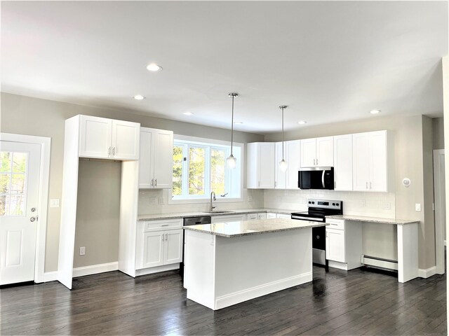 157R Sumner Wood Rd, Durham, CT 06422 - kitchen with baseboard heating, stainless steel appliances, a sink, and a wealth of natural light