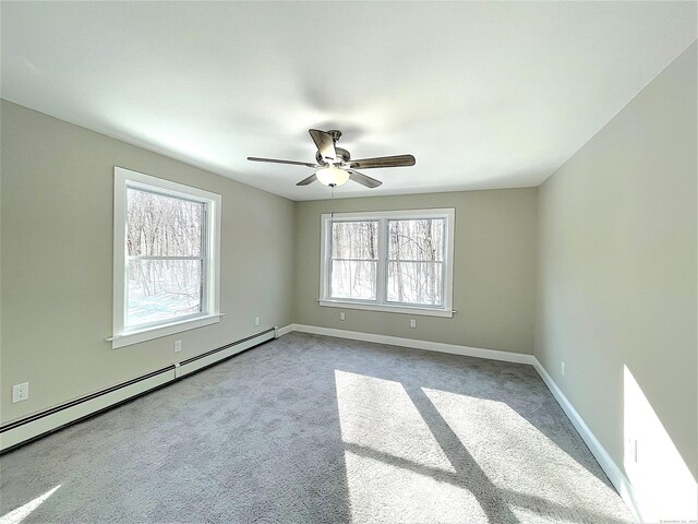 157R Sumner Wood Rd, Durham, CT 06422 - spare room featuring ceiling fan, carpet flooring, baseboards, and a baseboard heating unit
