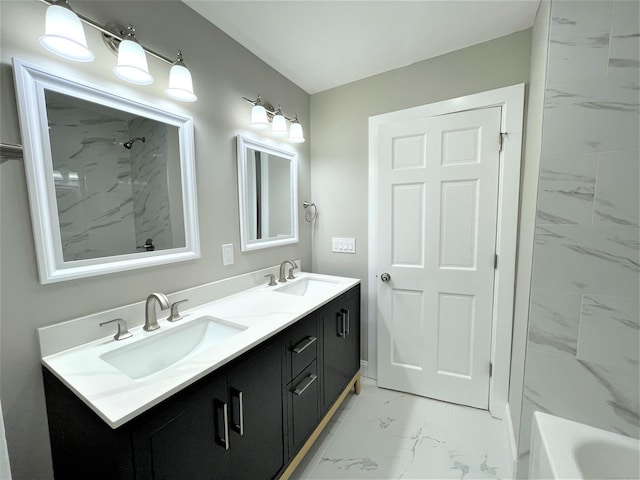 full bathroom with double vanity, marble finish floor, a shower, and a sink