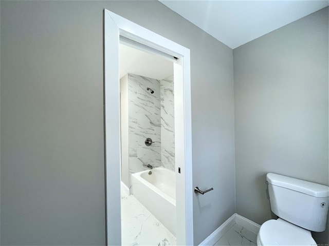 full bathroom featuring marble finish floor, toilet, and baseboards