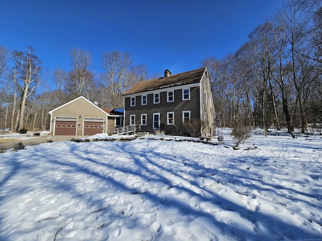 colonial-style house with a chimney