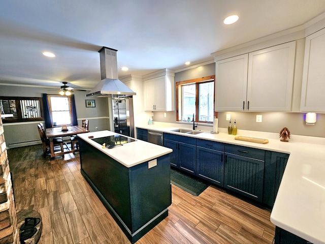 kitchen featuring island range hood, dishwasher, a kitchen island, black electric stovetop, and a sink