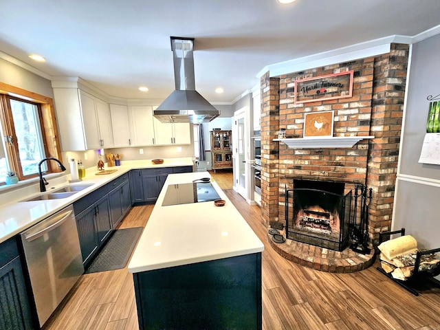 kitchen featuring crown molding, island exhaust hood, a sink, a kitchen island, and dishwasher