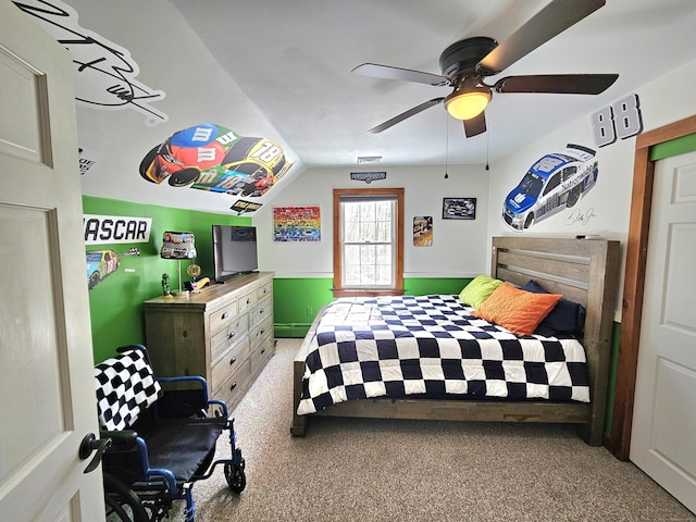 carpeted bedroom featuring lofted ceiling, visible vents, and ceiling fan