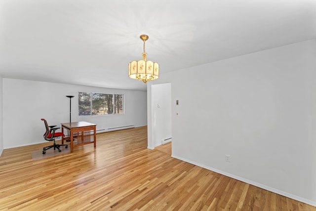 dining area featuring light wood-type flooring, baseboards, a notable chandelier, and baseboard heating