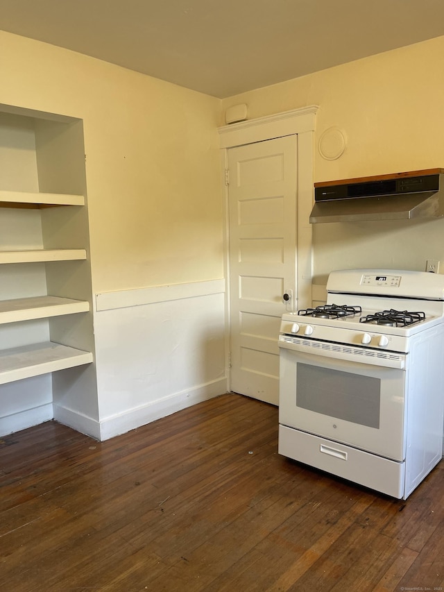 kitchen featuring baseboards, exhaust hood, dark wood finished floors, and white range with gas stovetop