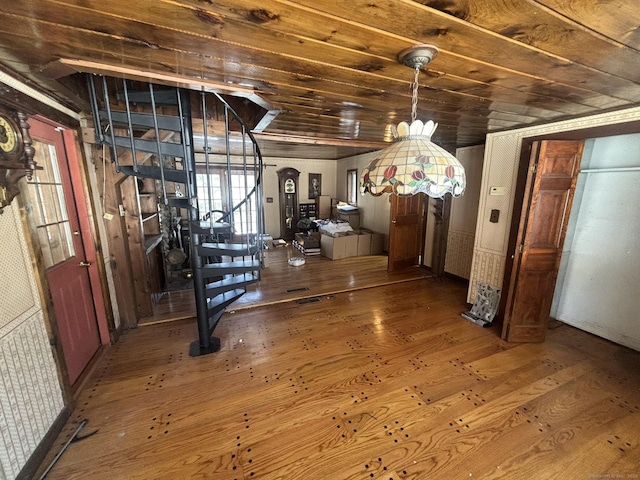 interior space with wood ceiling and wood-type flooring